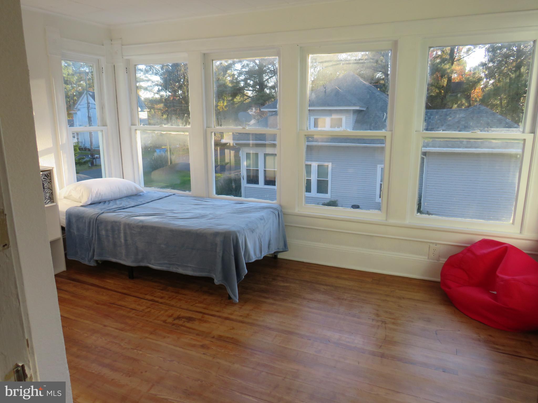 3372 Sackertown Road Crisfield, MD 21817 - Photo 25 of 29 a bedroom with a bed and window