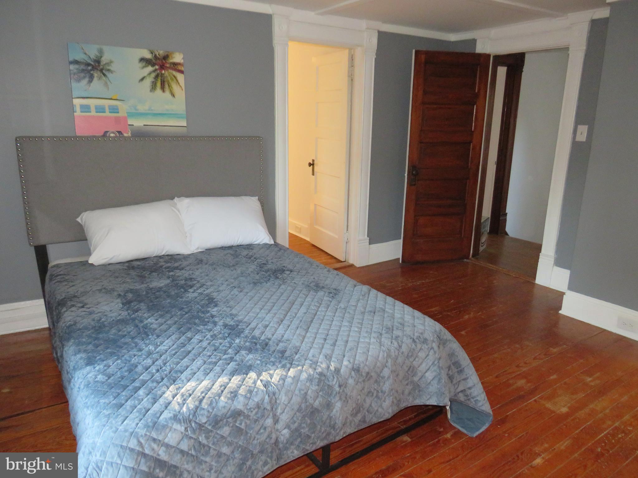 3372 Sackertown Road Crisfield, MD 21817 - Photo 26 of 29 a bedroom with a bed and a window