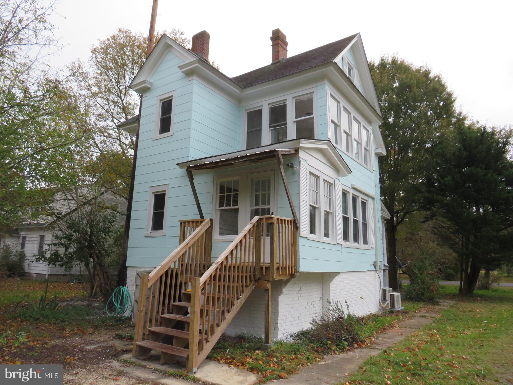 3372 Sackertown Road Crisfield, MD 21817 - Photo 4 of 29 a front view of a house with a yard