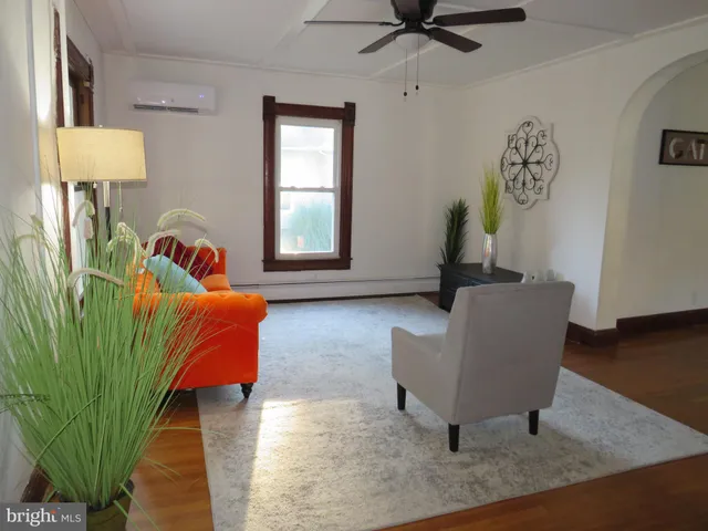 a living room with furniture and a rug