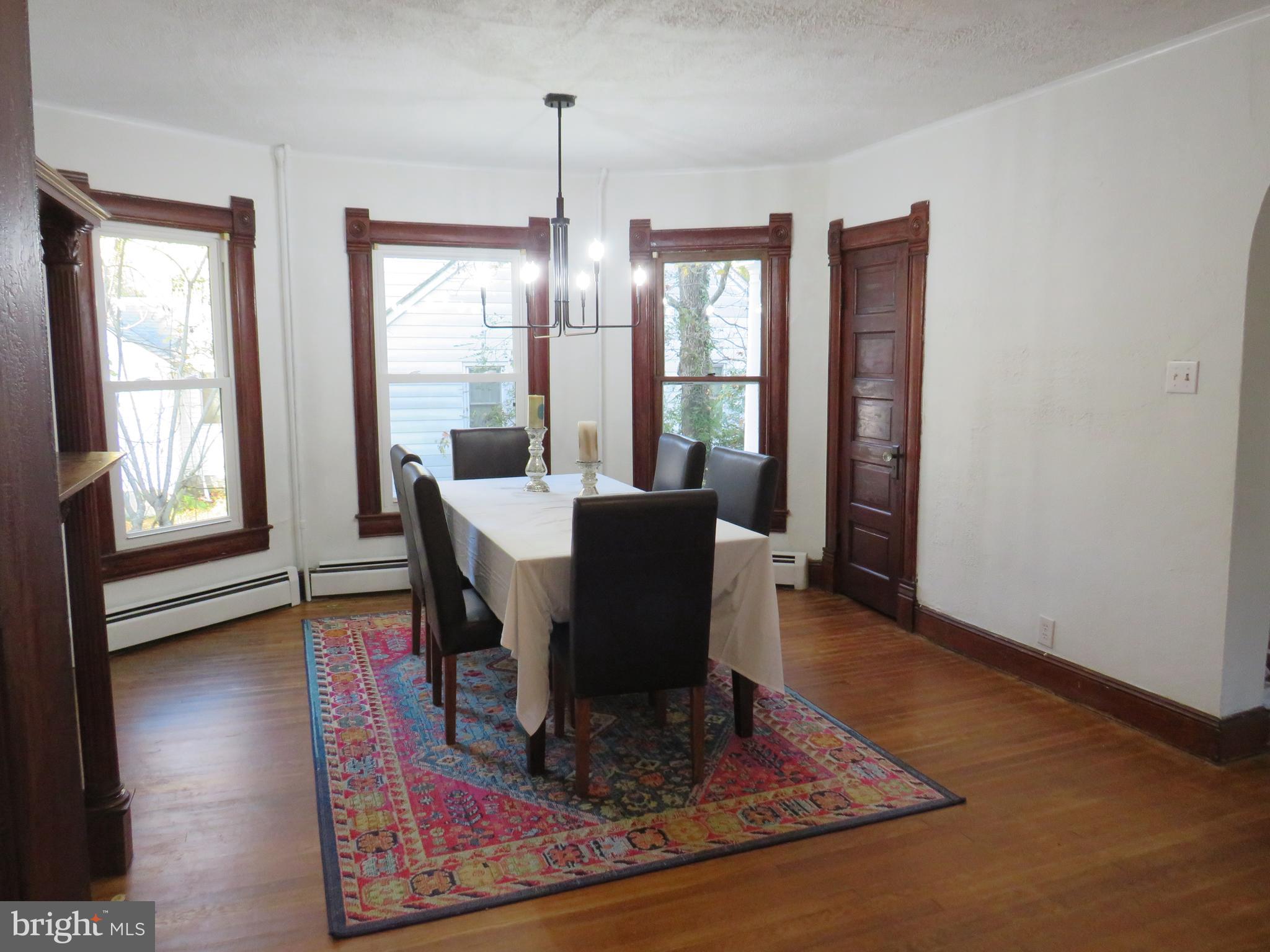 3372 Sackertown Road Crisfield, MD 21817 - Photo 9 of 29 a view of a dining room with furniture window and wooden floor
