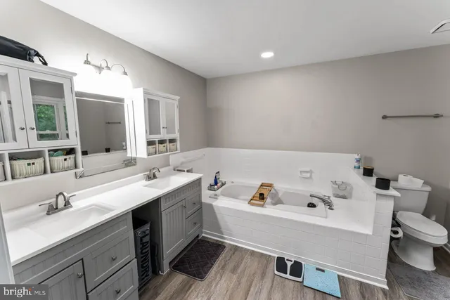 a view of kitchen and sink with wooden floor