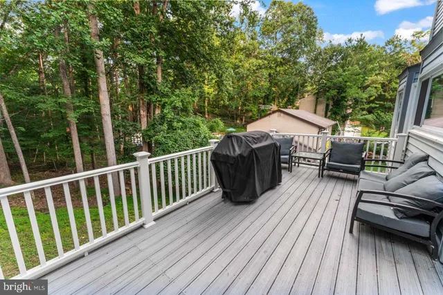 a view of a wooden deck with a bench