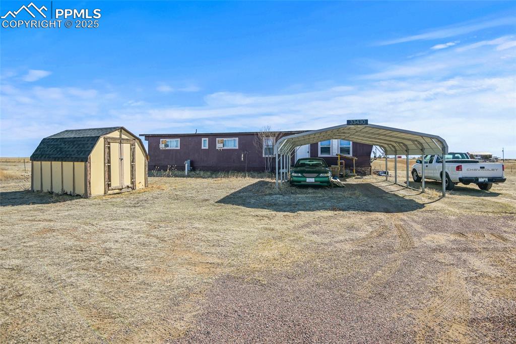 33440 Highway 94 Yoder, CO 80864 - Photo 13 of 30 a view of a house with a yard