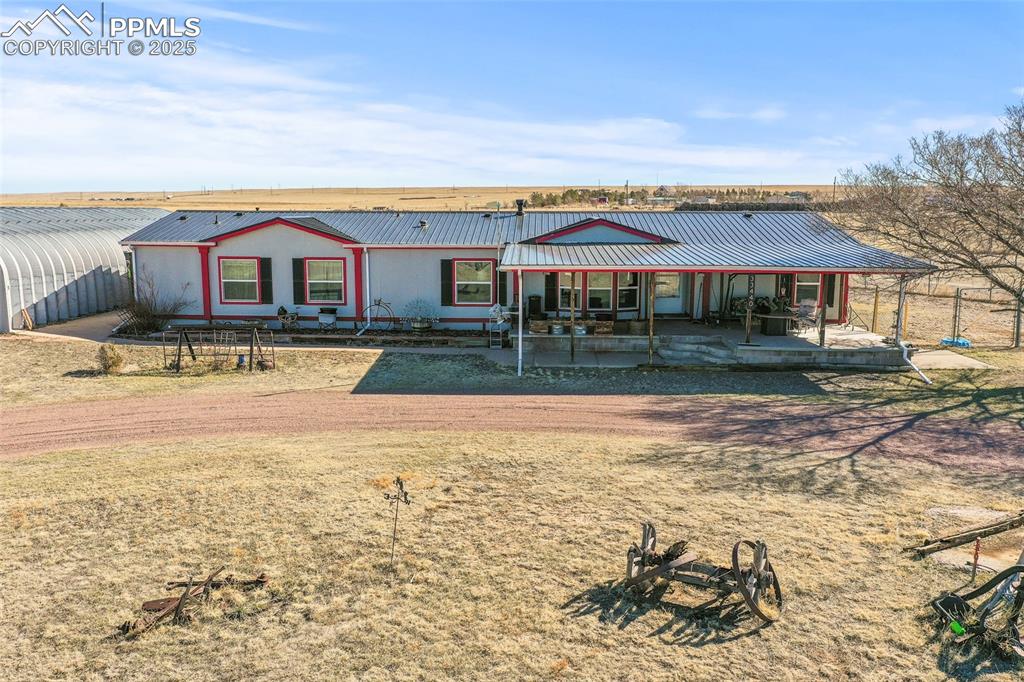 33440 Highway 94 Yoder, CO 80864 - Photo 15 of 30 a front view of a house with a yard