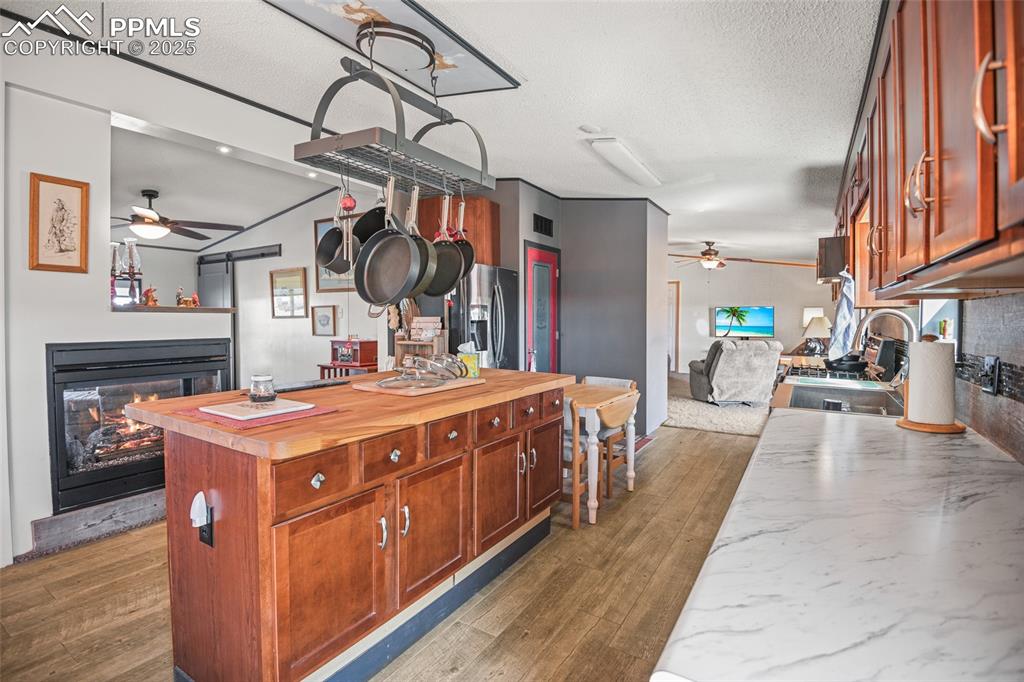 33440 Highway 94 Yoder, CO 80864 - Photo 20 of 30 a kitchen with stainless steel appliances granite countertop a stove and a refrigerator