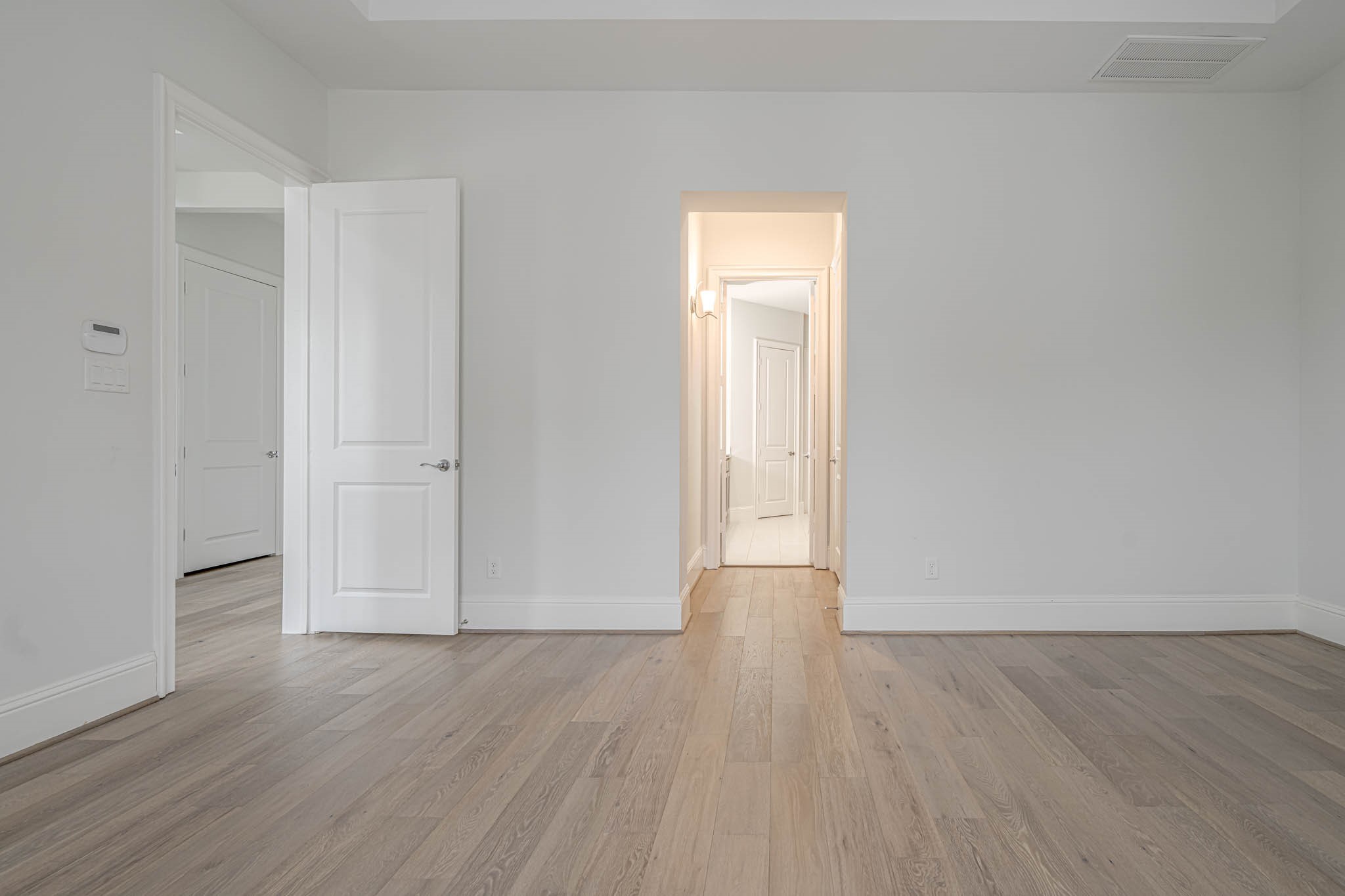 7715 South Fall Run Crossing Houston, TX 77055 - Photo 15 of 22 a view of an empty room and wooden floor