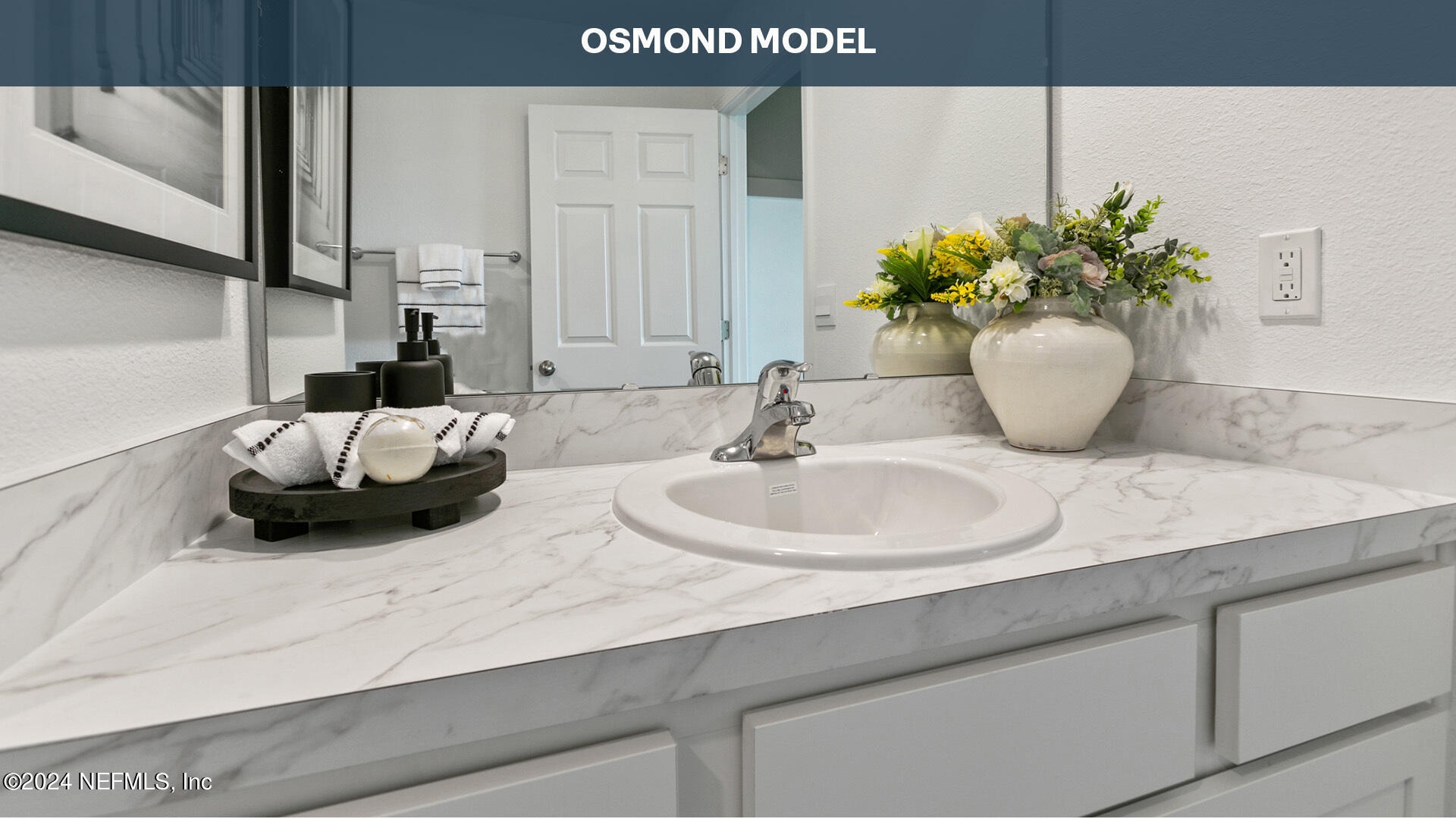 74 Montellano Road St. Augustine, FL 32084 - Photo 35 of 62 a bathroom with a sink and a mirror