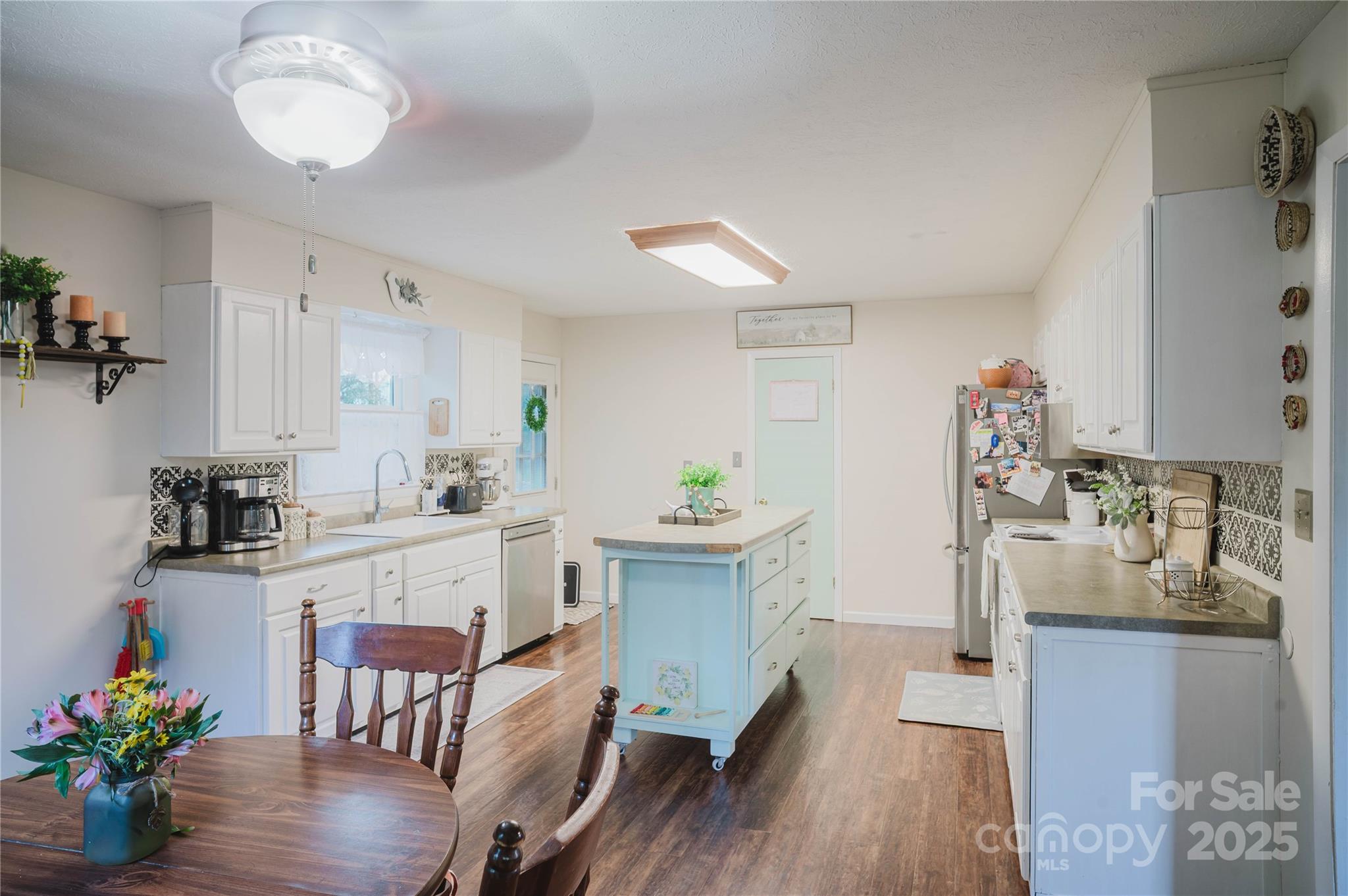 20 Ridgeway Drive Flat Rock, NC 28731 - Photo 18 of 47 a kitchen with a table and chairs in it