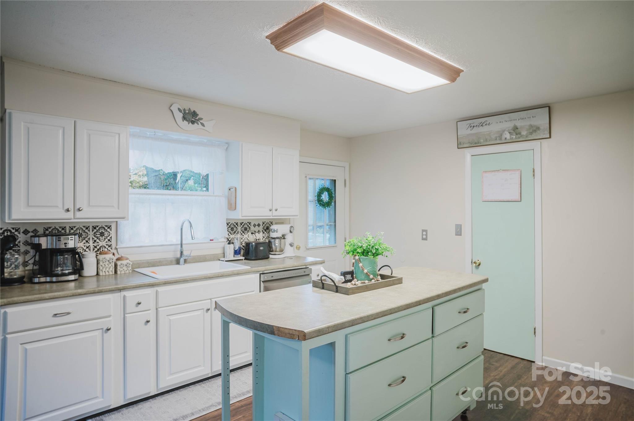 20 Ridgeway Drive Flat Rock, NC 28731 - Photo 19 of 47 a kitchen with granite countertop white cabinets white appliances and a sink