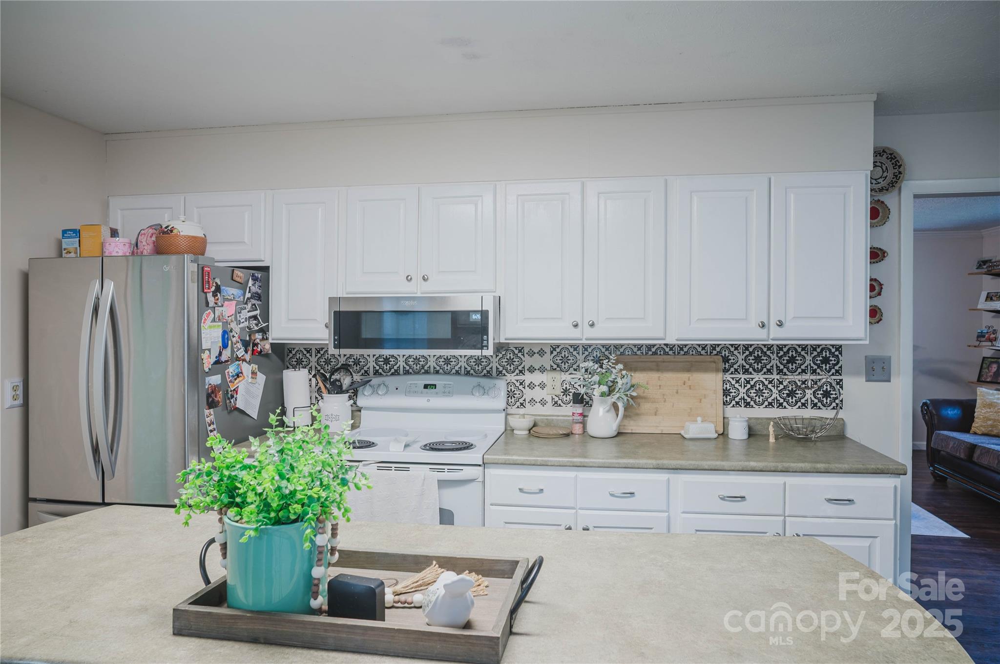 20 Ridgeway Drive Flat Rock, NC 28731 - Photo 21 of 47 a kitchen with stainless steel appliances white cabinets a refrigerator and a stove