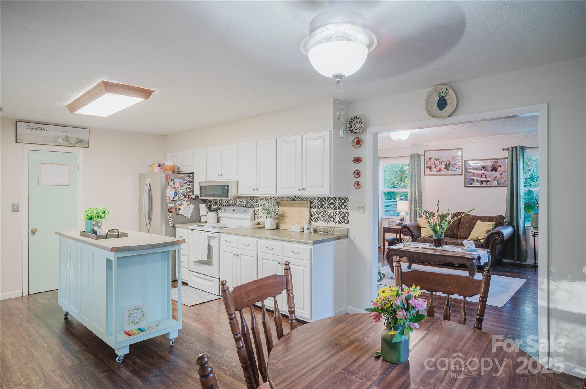 20 Ridgeway Drive Flat Rock, NC 28731 - Photo 22 of 47 a kitchen with furniture and a wooden floor