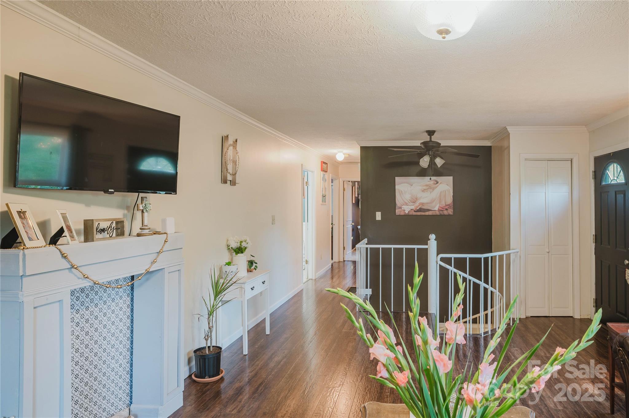 20 Ridgeway Drive Flat Rock, NC 28731 - Photo 23 of 47 a view of a livingroom with wooden floor and a flat screen tv