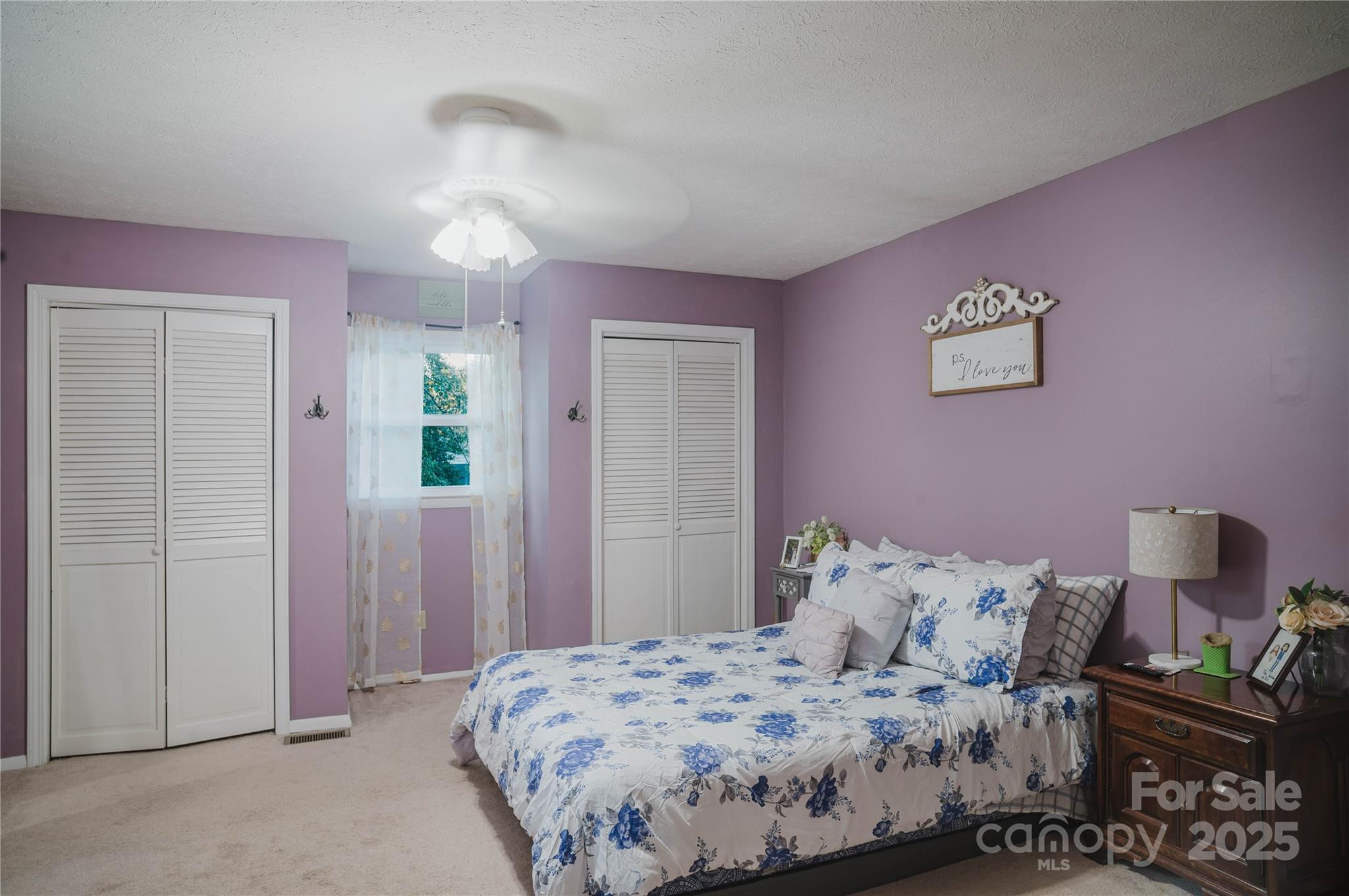 20 Ridgeway Drive Flat Rock, NC 28731 - Photo 33 of 47 a bedroom with a bed and a chandelier