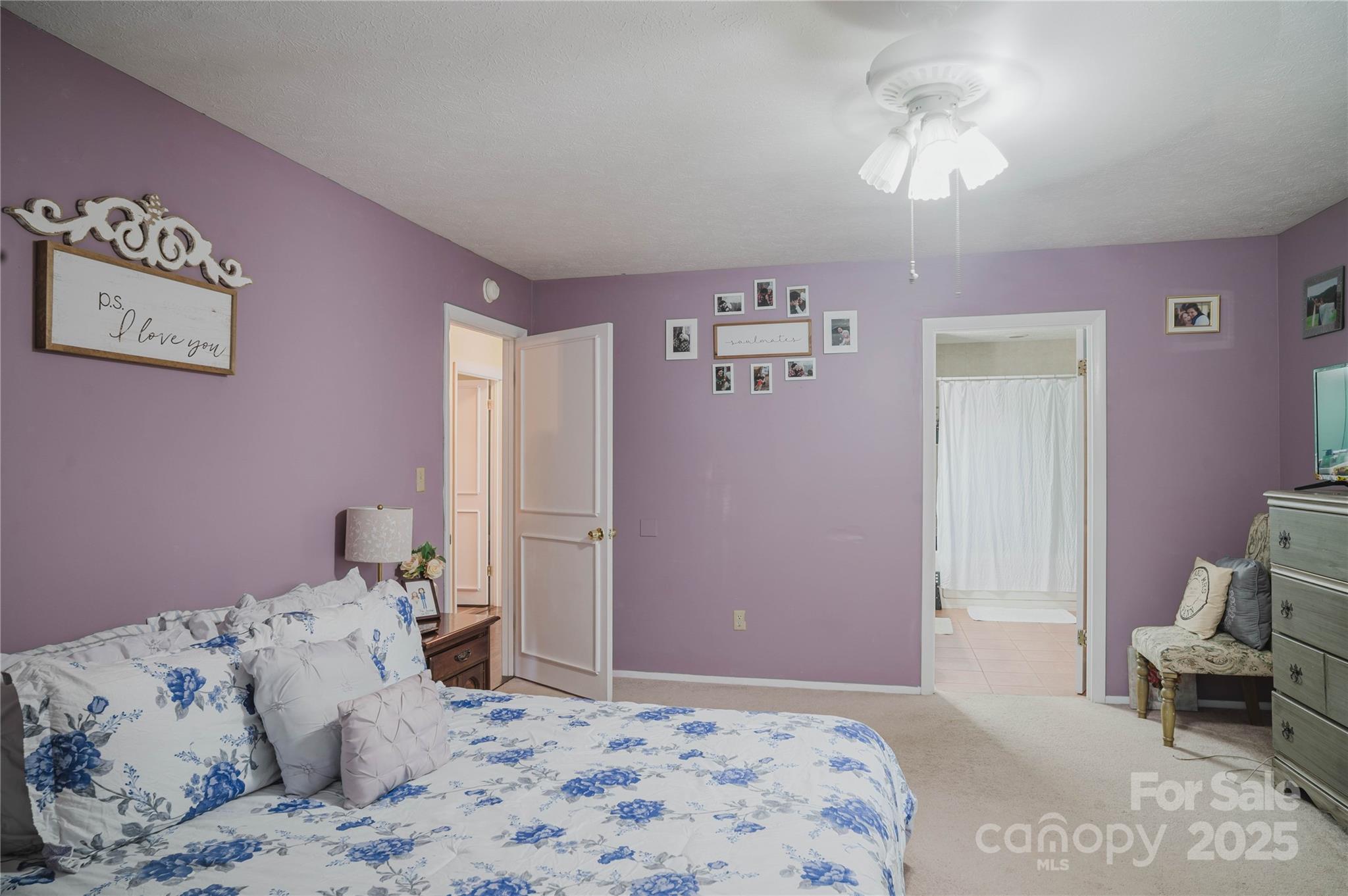 20 Ridgeway Drive Flat Rock, NC 28731 - Photo 34 of 47 a bedroom with a bed and a chandelier