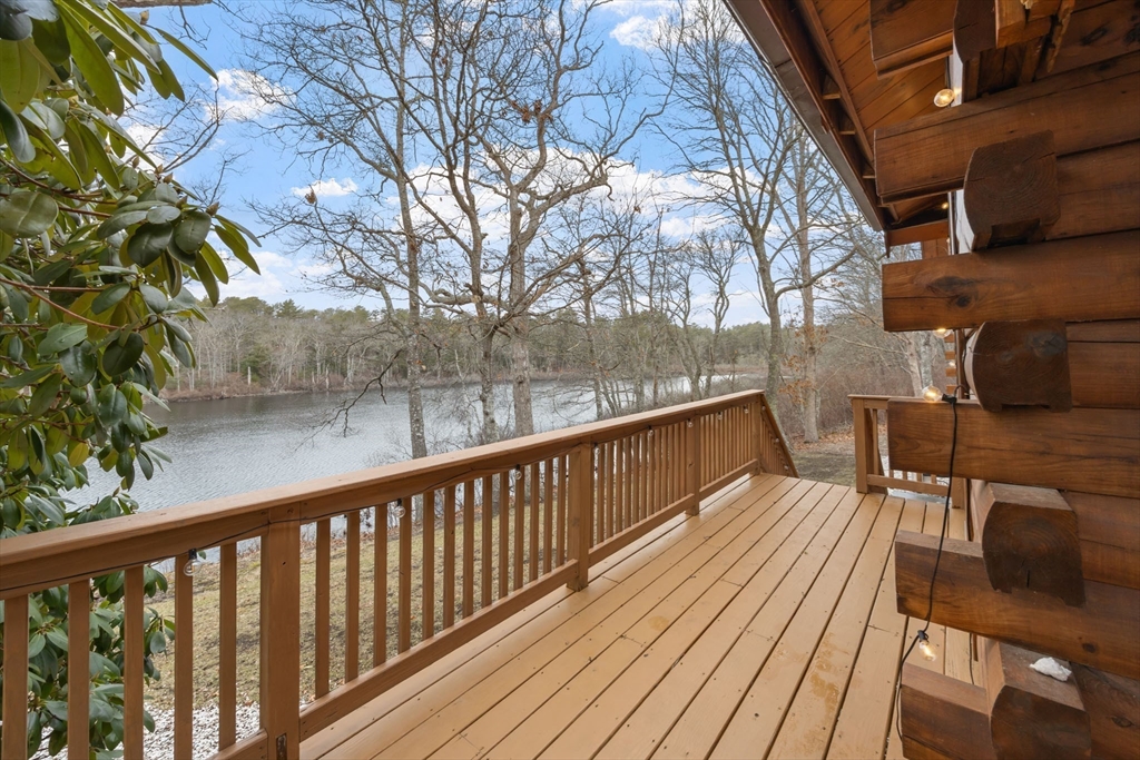 119 Valley Bars Road Bourne, MA 02532 - Photo 3 of 36 a view of balcony with wooden floor and seating space