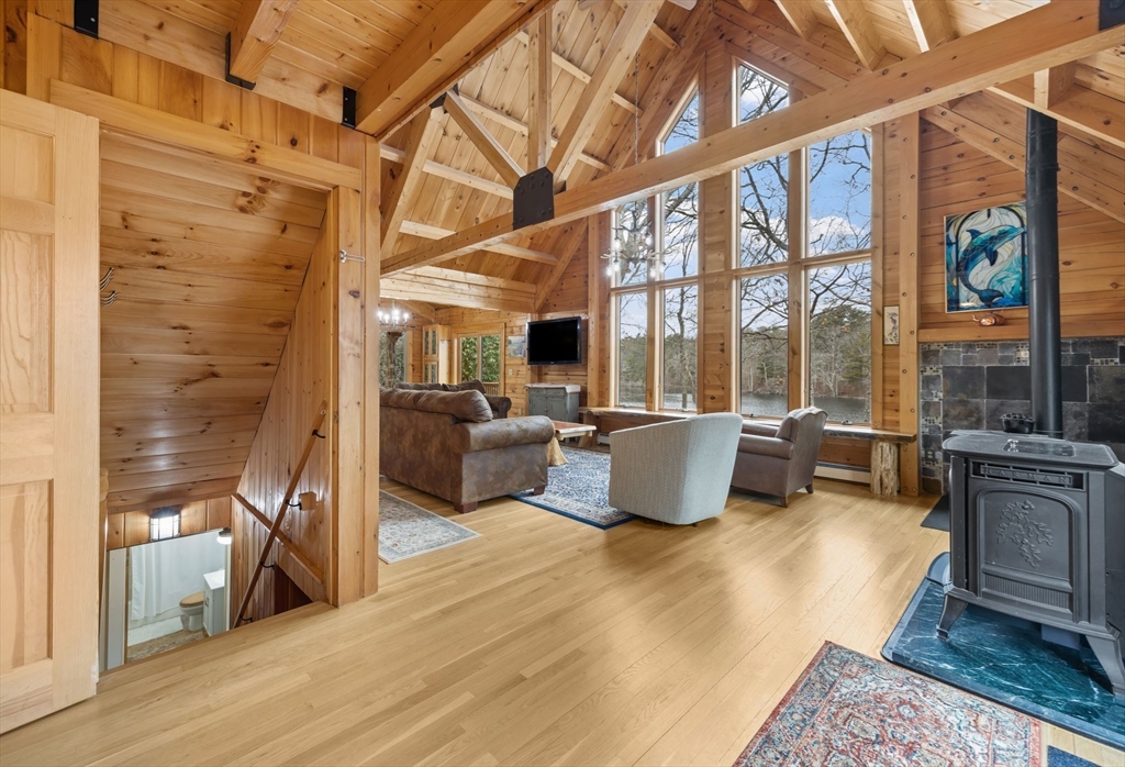 119 Valley Bars Road Bourne, MA 02532 - Photo 5 of 36 a living room with furniture large windows and flat screen tv