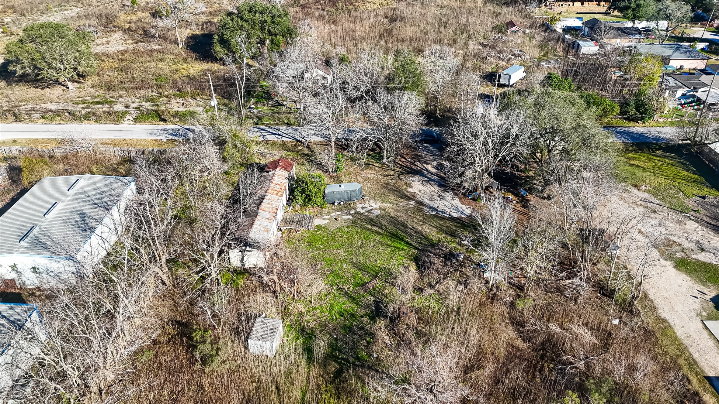 3934 Fuqua Street Houston, TX 77047 - Photo 26 of 43 a view of a yard with plants and large trees