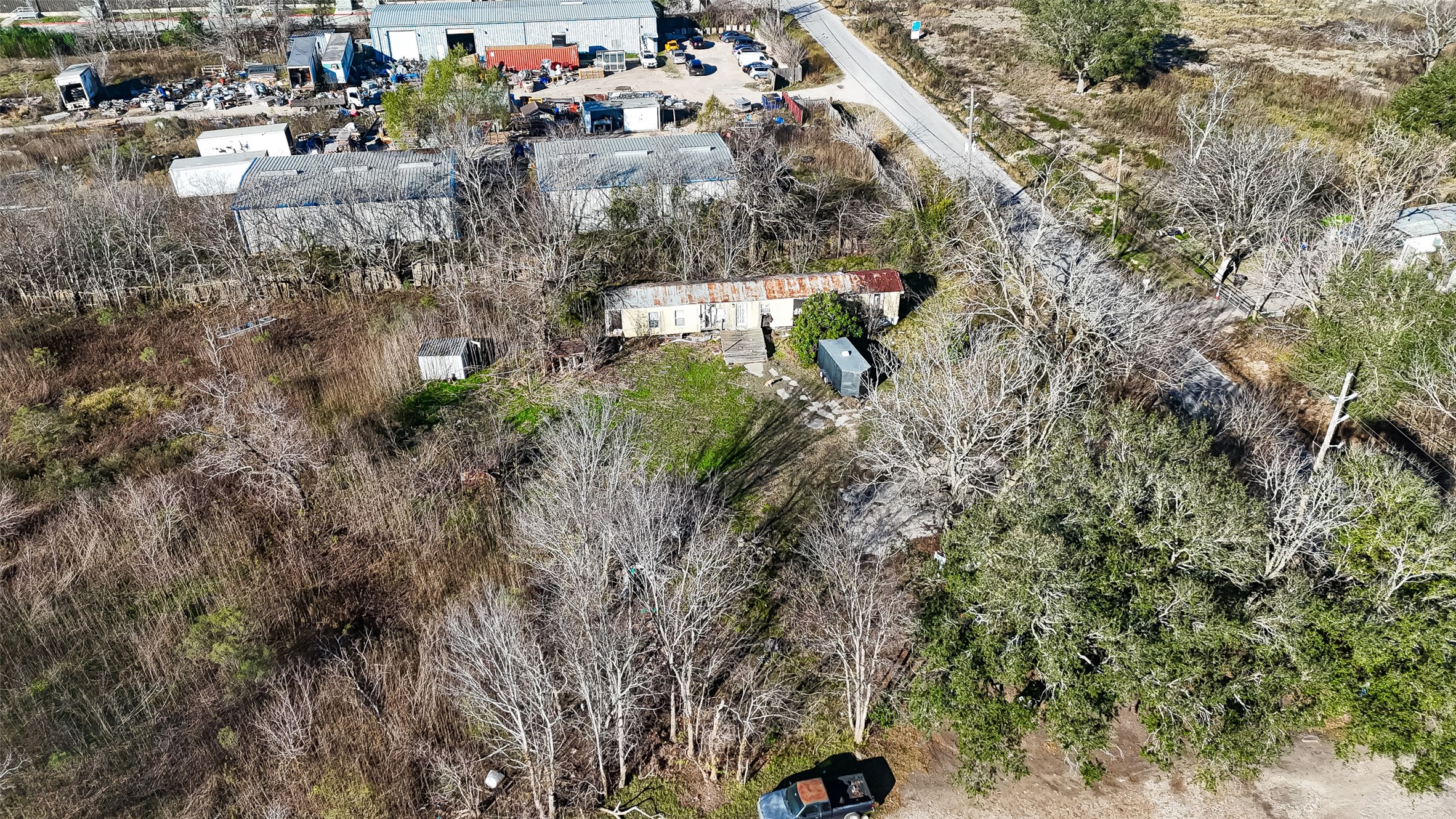 3934 Fuqua Street Houston, TX 77047 - Photo 27 of 43 a backyard of a building with lots of trees