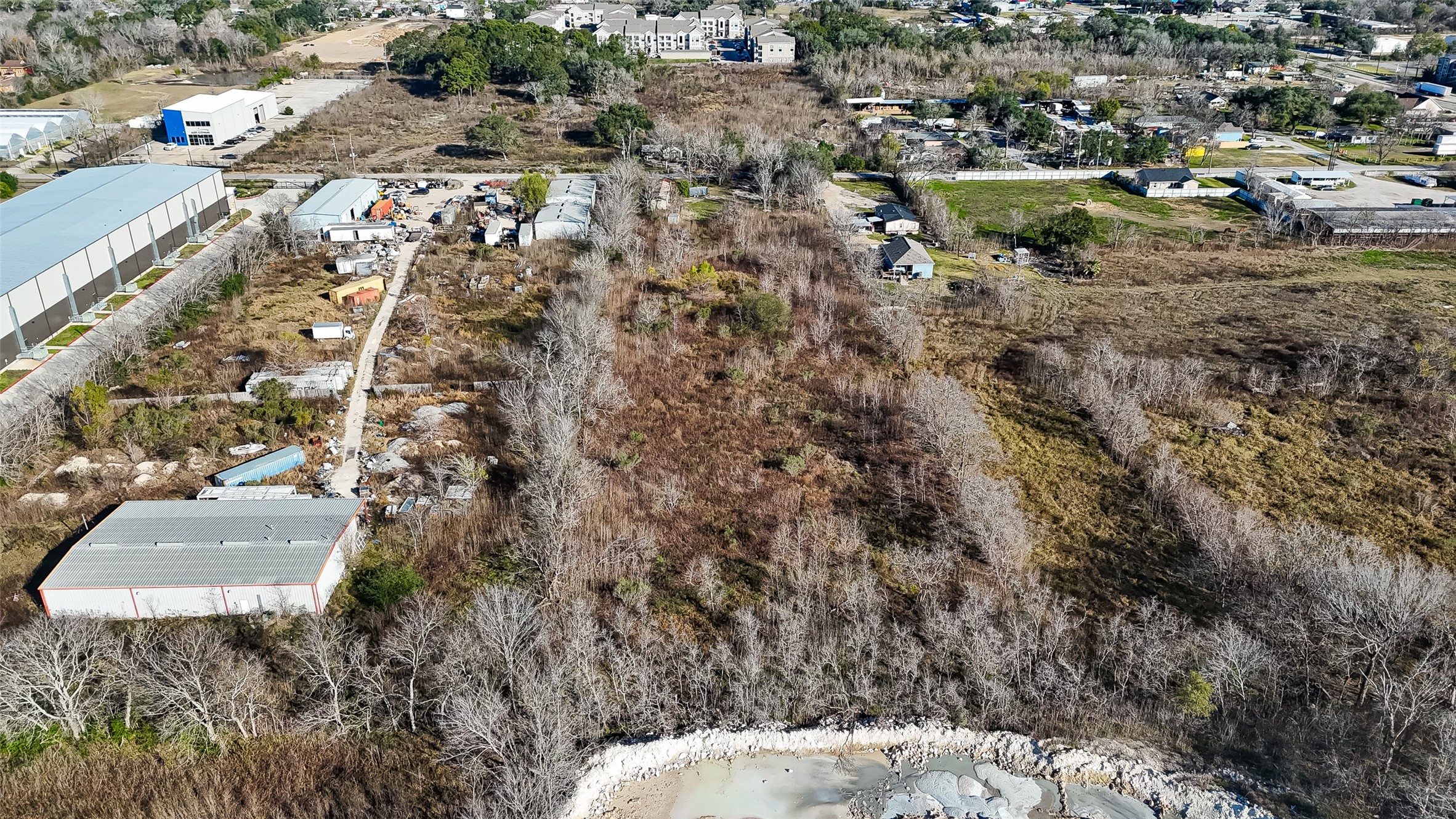 3934 Fuqua Street Houston, TX 77047 - Photo 9 of 43 an aerial view of residential house with outdoor space and parking