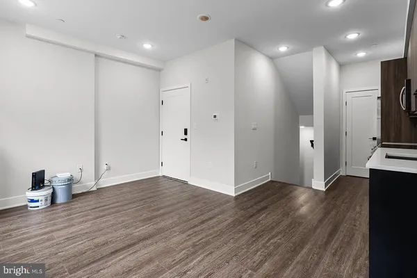 a view of a kitchen with wooden floor