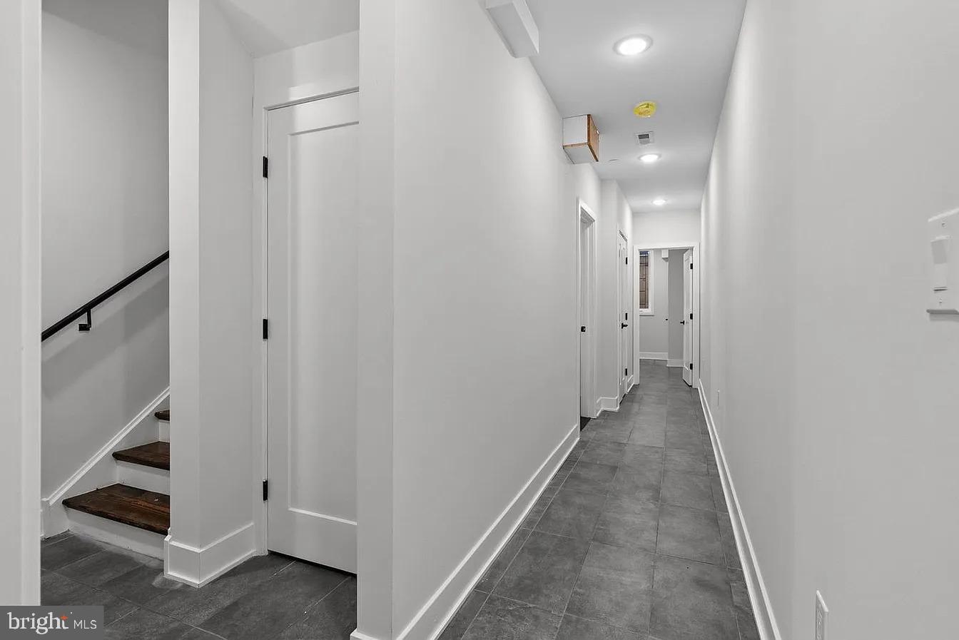 2146 North Front Street, Unit 1 Philadelphia, PA 19122 - Photo 6 of 16 a view of a hallway with white walls