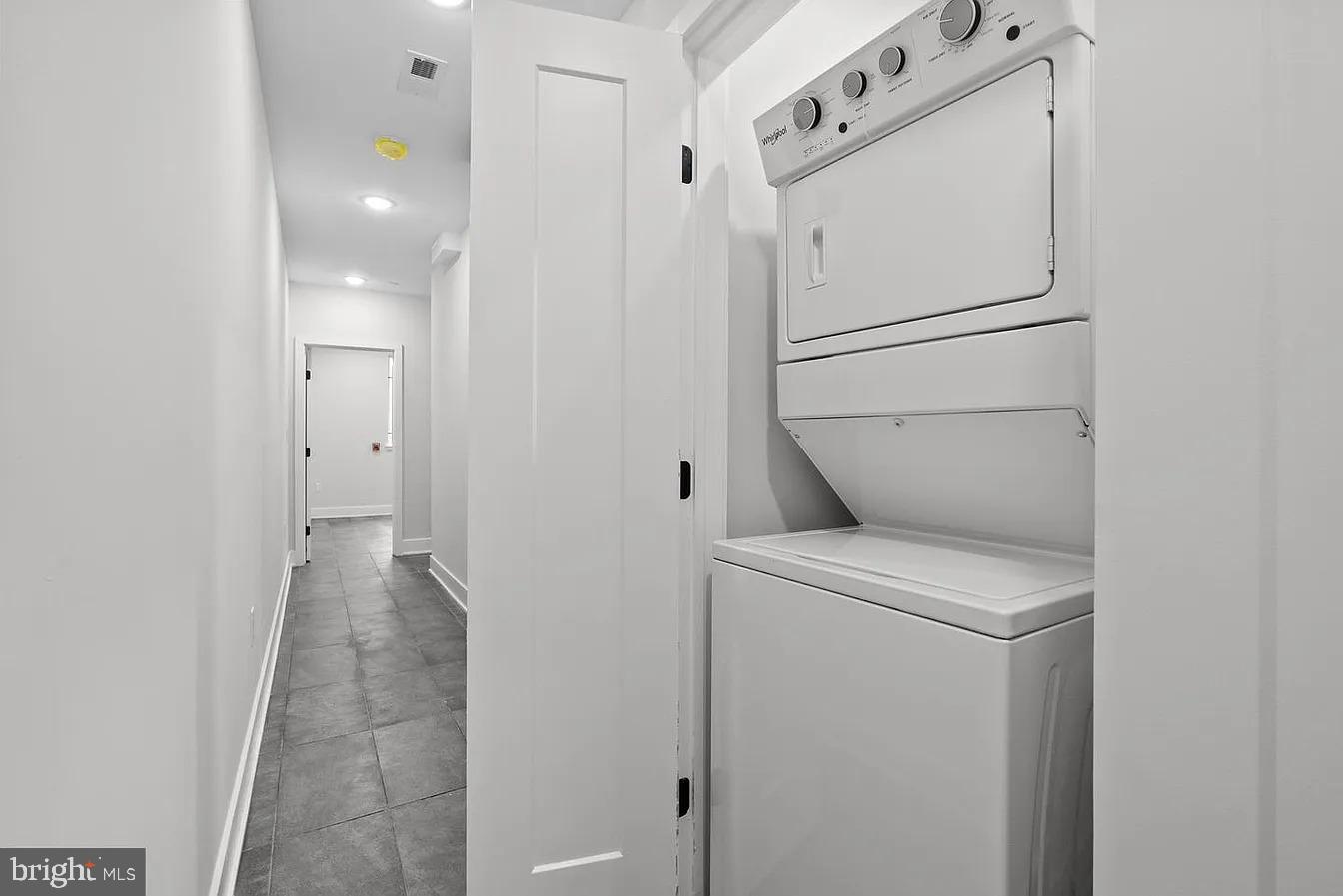 2146 North Front Street, Unit 1 Philadelphia, PA 19122 - Photo 7 of 16 a view of storage and utility room with washer and dryer