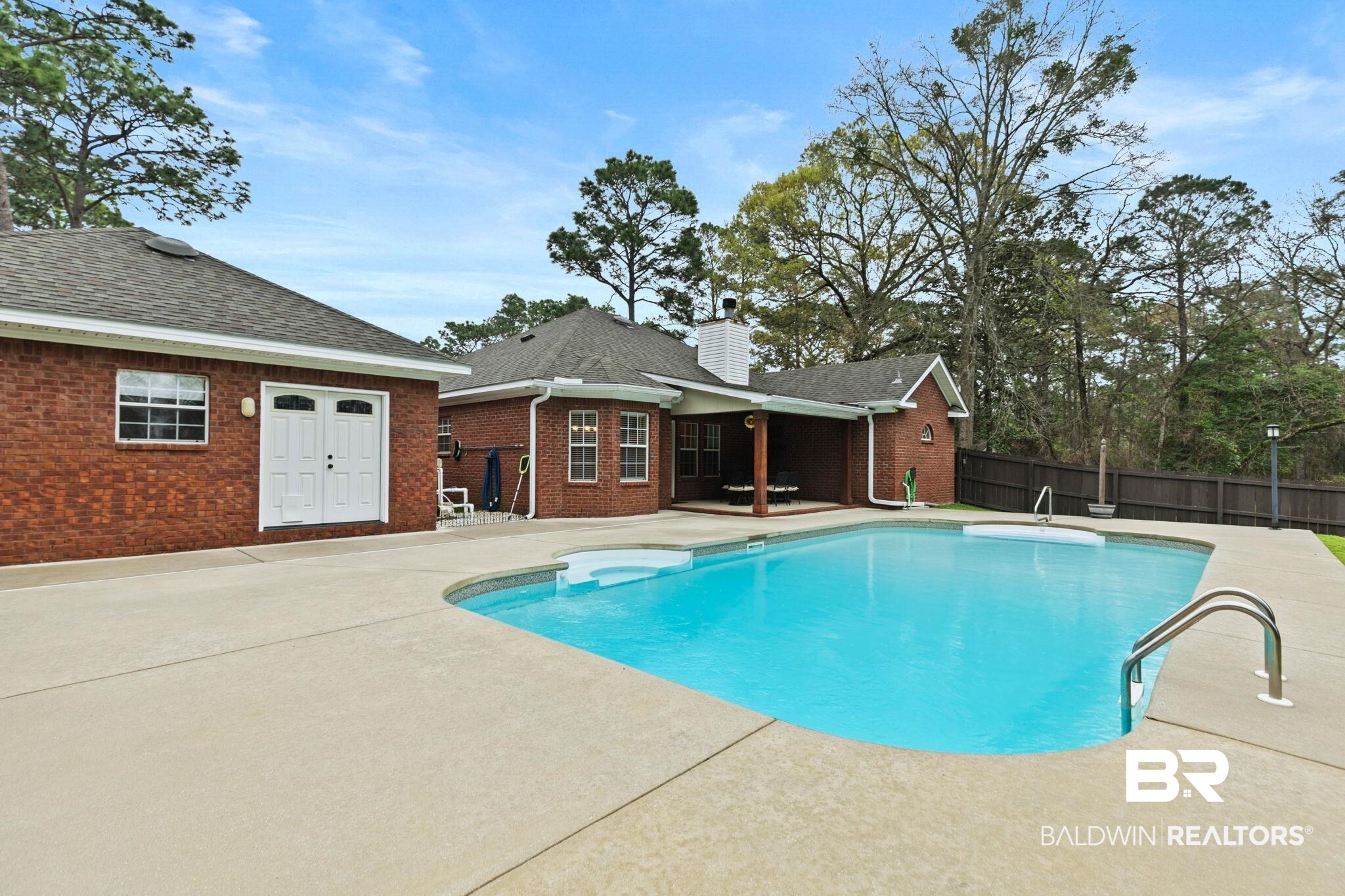 32185 Buzbee Road Daphne, AL 36527 - Photo 32 of 47 View of swimming pool featuring patio surround and a fenced backyard