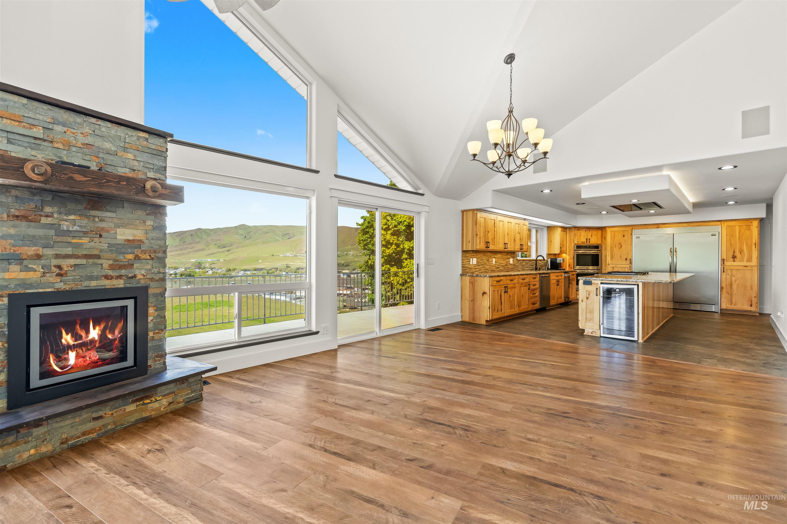 3360 East Main Street Lewiston, ID 83501 - Photo 11 of 50 Open-concept living area with vaulted ceilings and wood-finish flooring