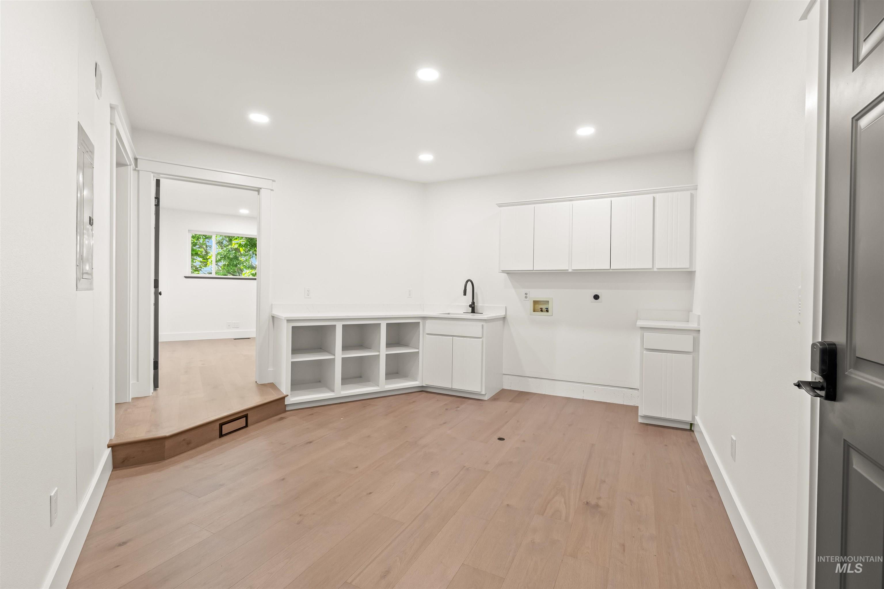 3360 East Main Street Lewiston, ID 83501 - Photo 24 of 50 Utility room with light wood-finish flooring, recessed lighting, and white baseboards