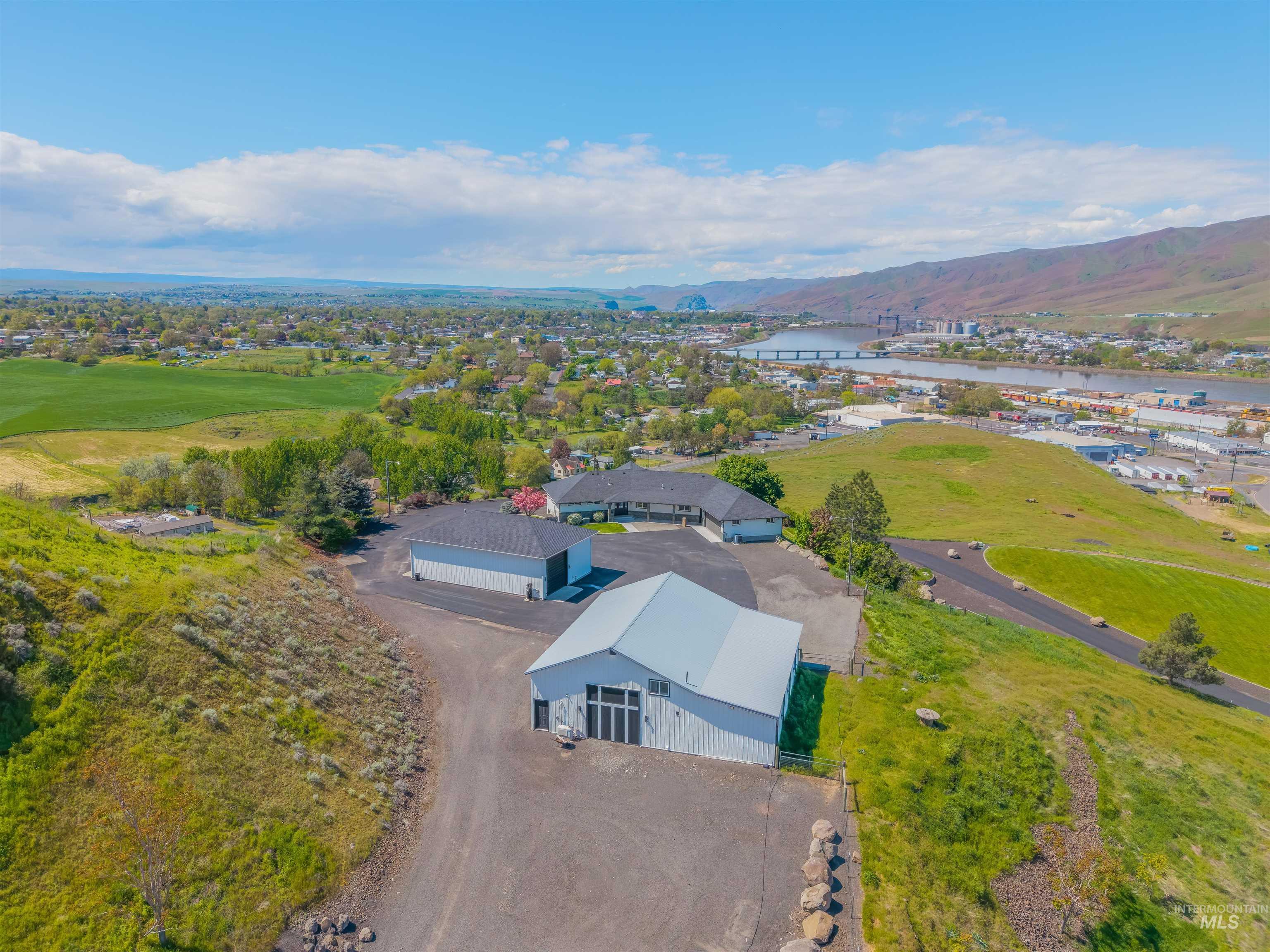 3360 East Main Street Lewiston, ID 83501 - Photo 5 of 50 Aerial perspective featuring two detached structures on a sloped lot