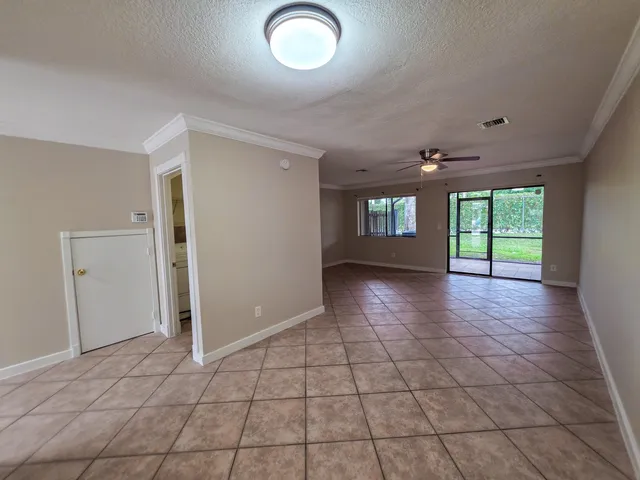 an empty room with windows and entrance
