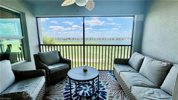 a balcony with furniture and a view