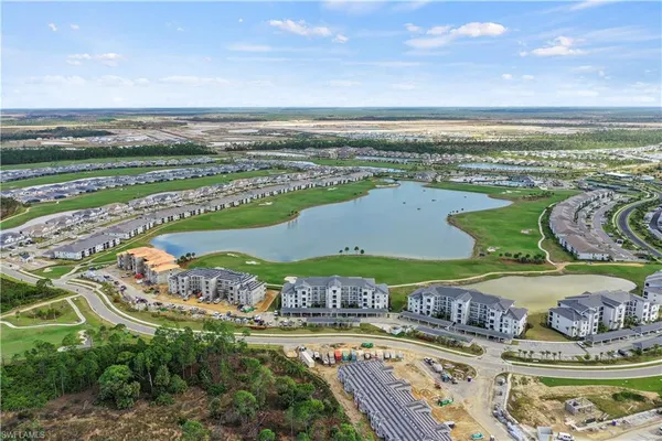 a view of a swimming pool and an outdoor seating