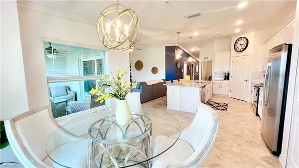 a dining room with furniture window and outside view