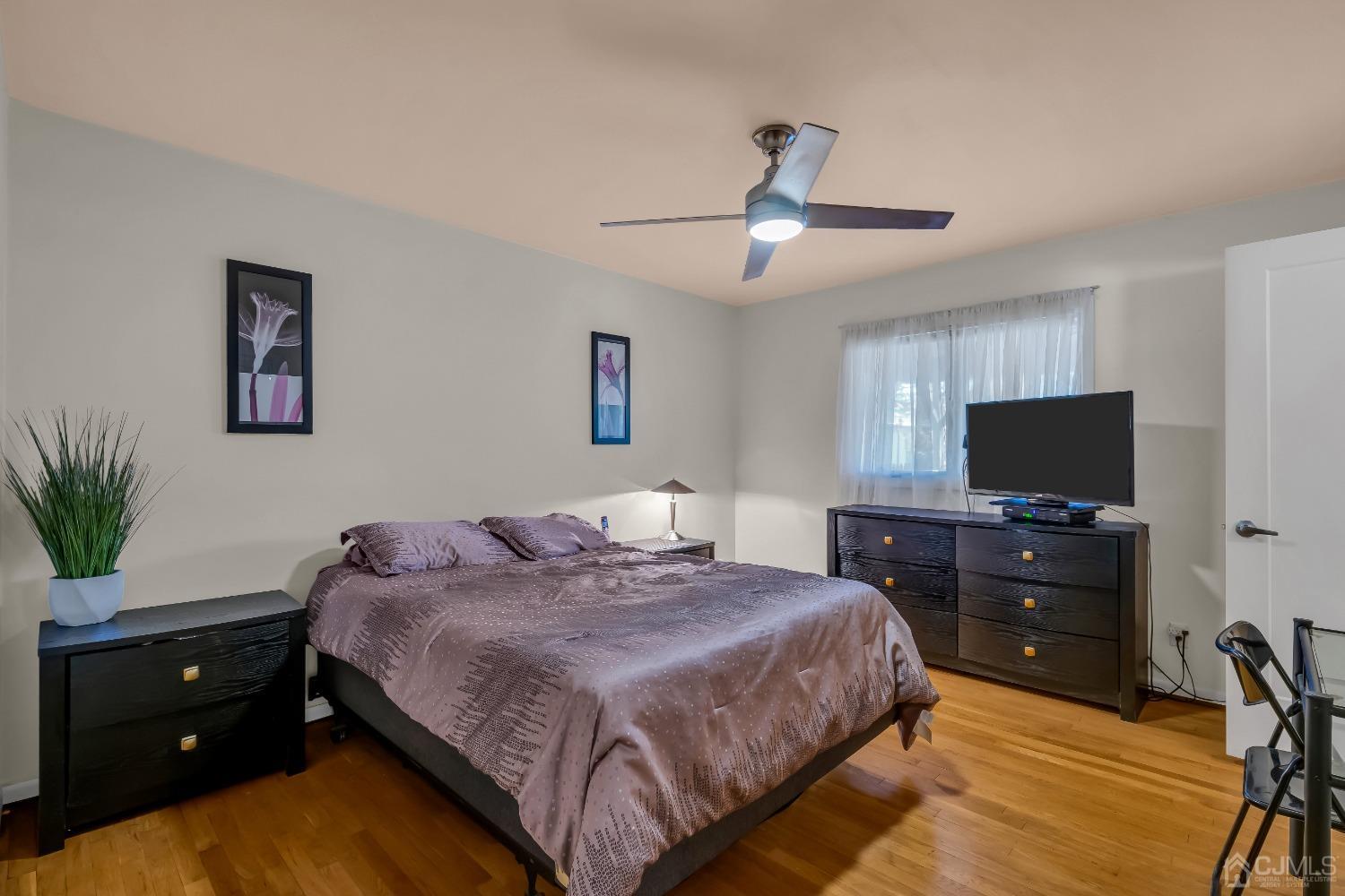 6 Georgetown Road Old Bridge, NJ 08859 - Photo 29 of 45 a bedroom with a bed and a flat screen tv