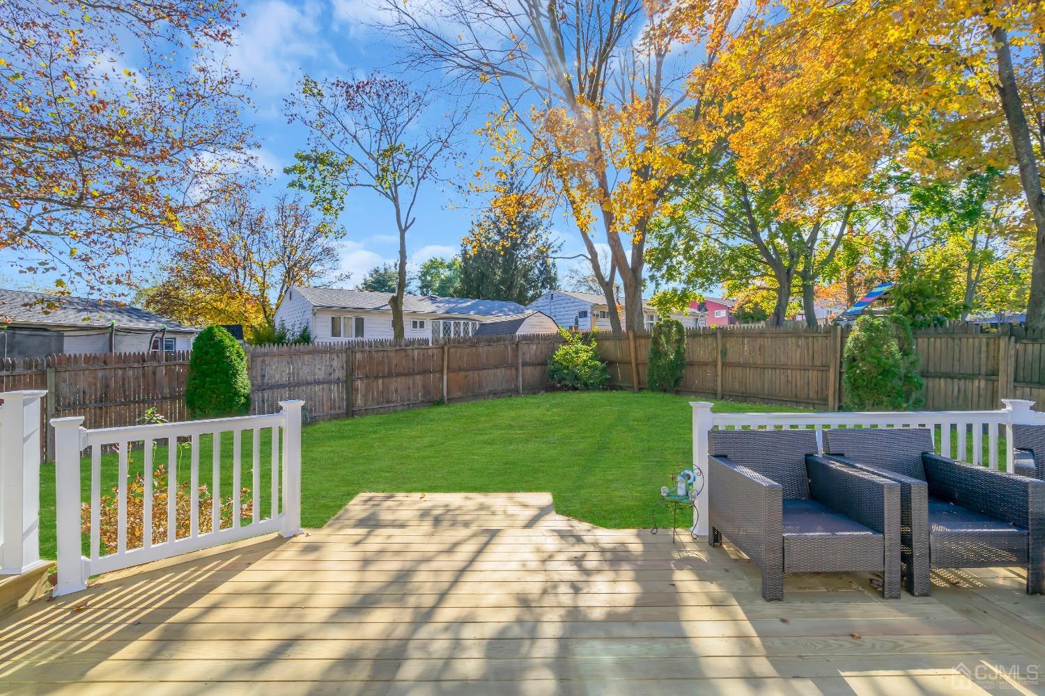 6 Georgetown Road Old Bridge, NJ 08859 - Photo 40 of 45 a view of a backyard with table and chairs and a fire pit