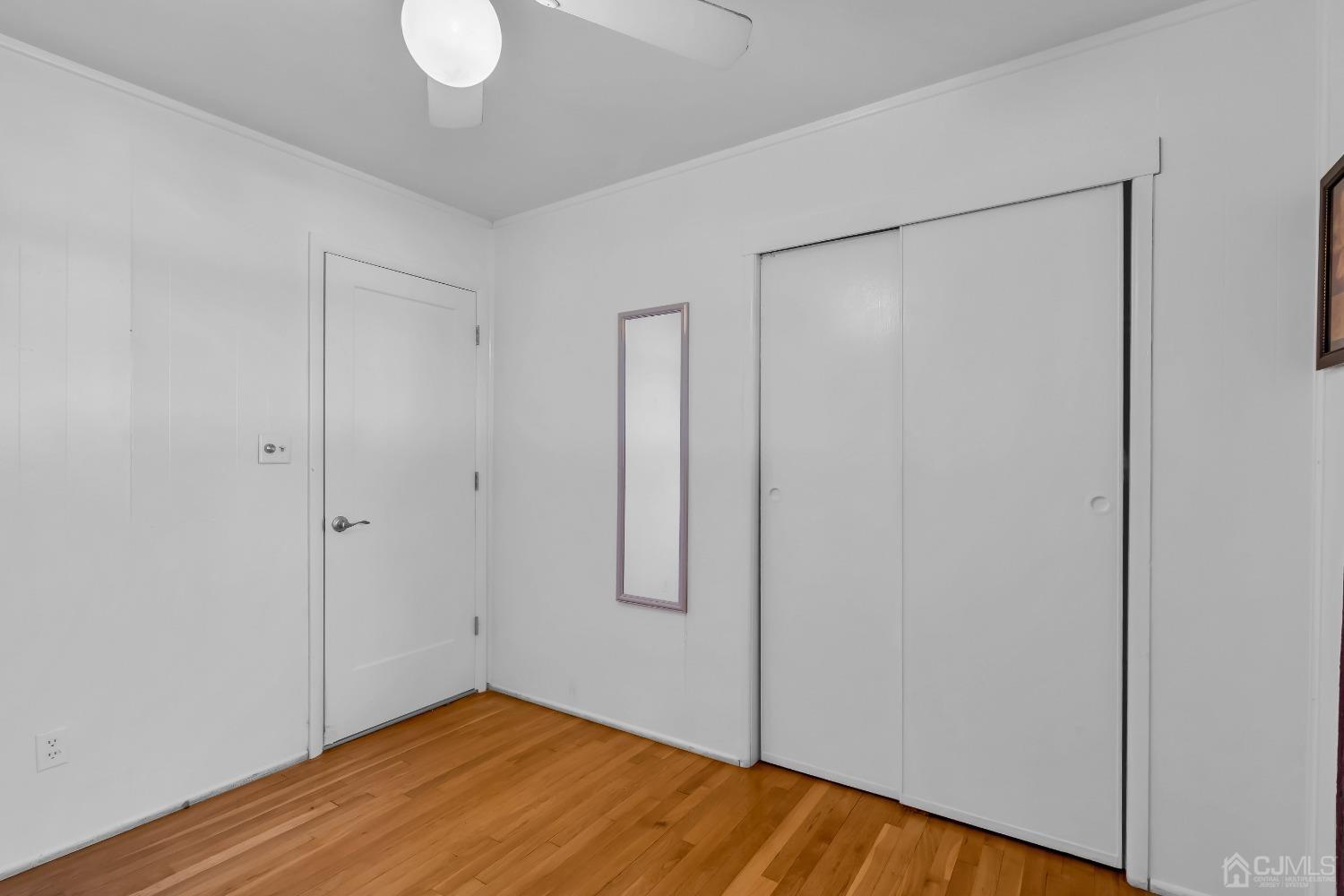 6 Georgetown Road Old Bridge, NJ 08859 - Photo 4 of 45 a view of empty room with wooden floor