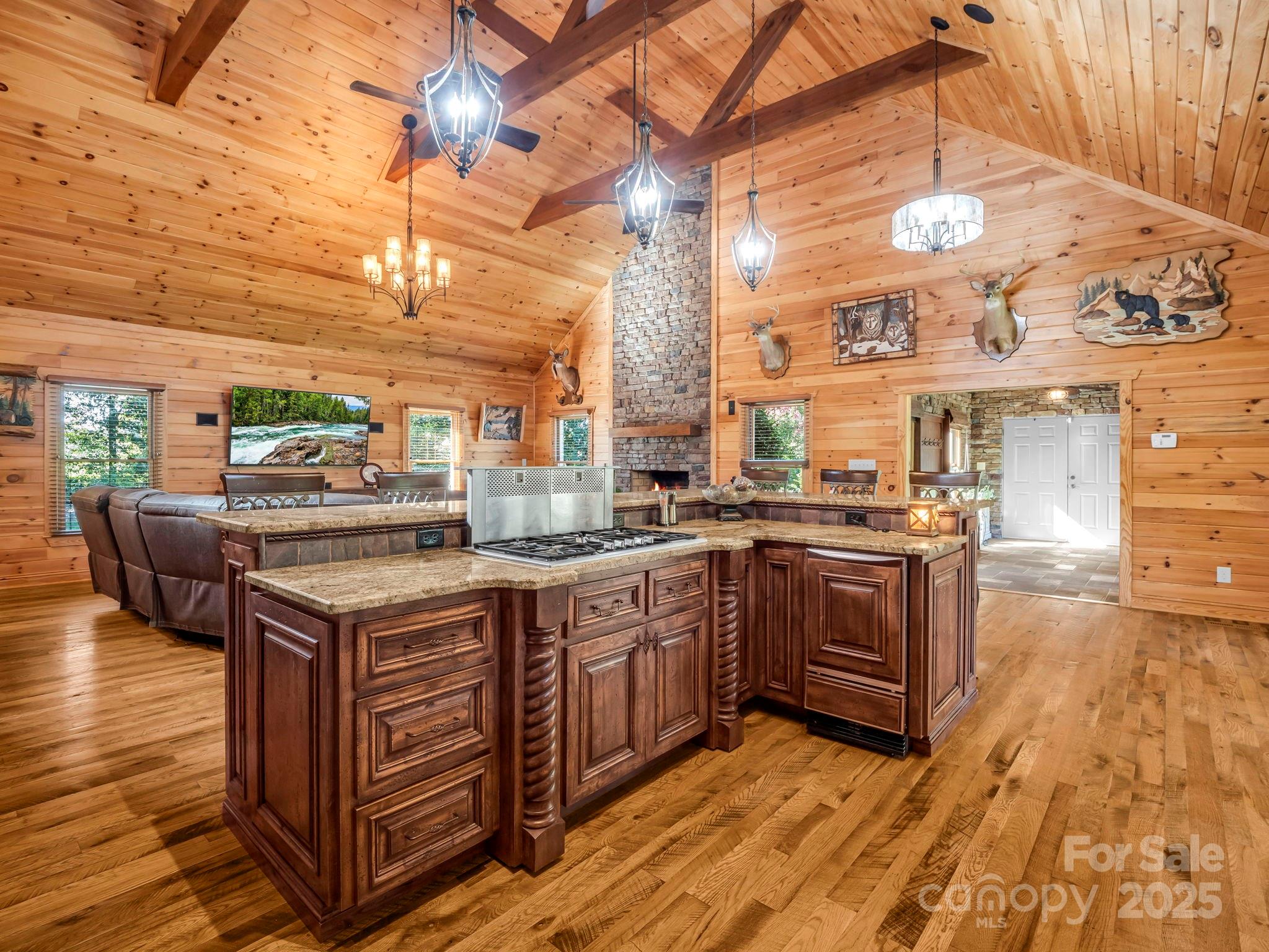 1235 Bob Falls Road Shelby, NC 28150 - Photo 12 of 47 a kitchen with stainless steel appliances granite countertop a stove a sink and a wooden floors