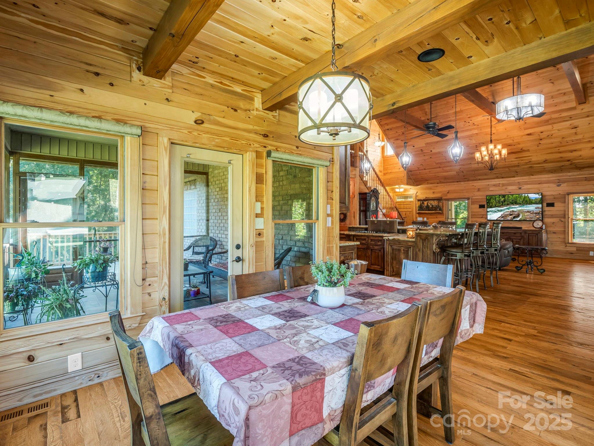 1235 Bob Falls Road Shelby, NC 28150 - Photo 15 of 47 a view of a dining room with furniture a chandelier and wooden floor