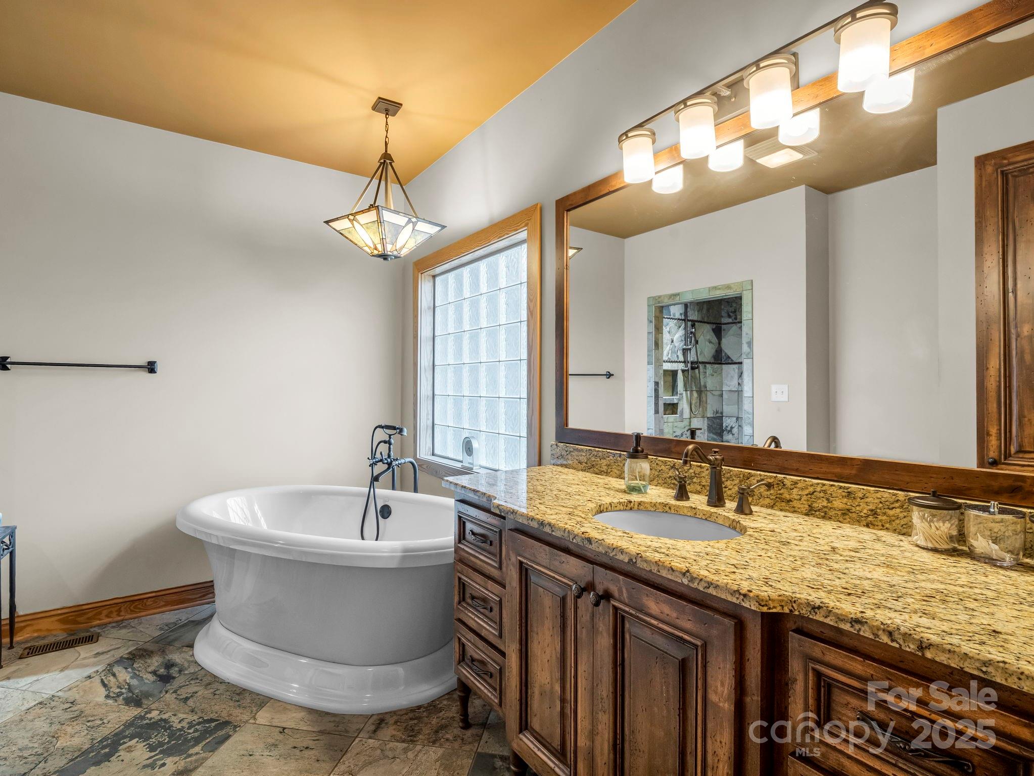 1235 Bob Falls Road Shelby, NC 28150 - Photo 21 of 47 a bathroom with a granite countertop sink and a large mirror