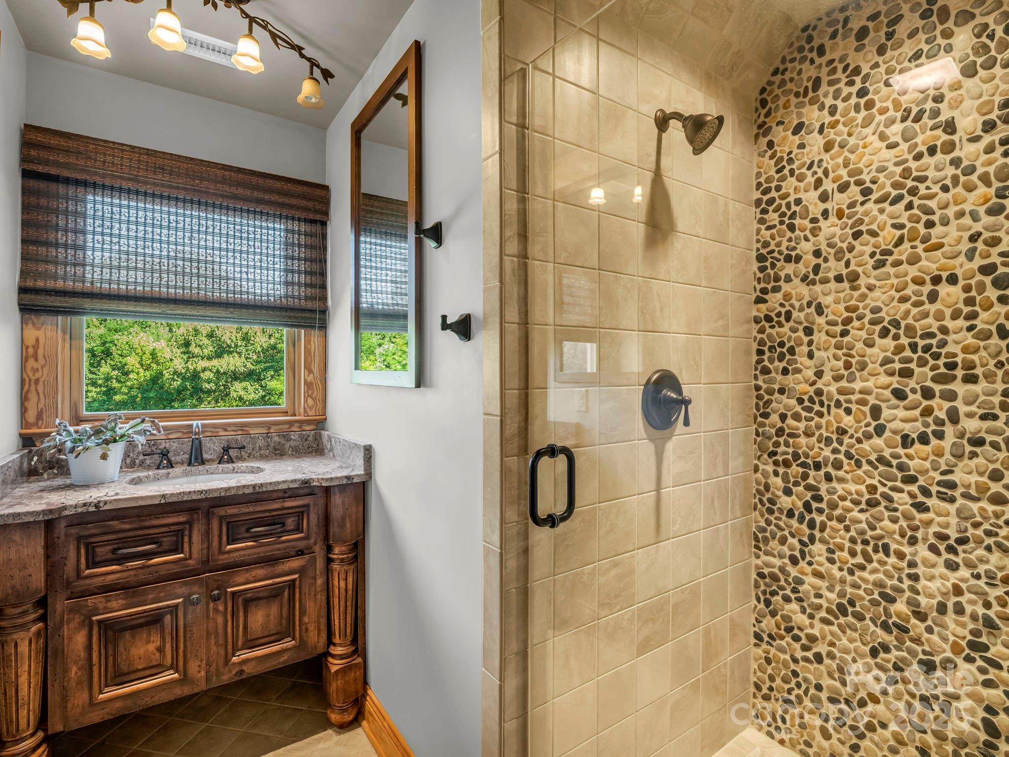 1235 Bob Falls Road Shelby, NC 28150 - Photo 30 of 47 a bathroom with a sink a vanity and a shower