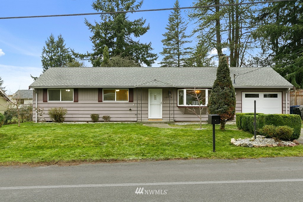 10826 Southeast 182nd Street Renton, WA 98055 - Photo 1 of 1 a front view of a house with a garden and plants