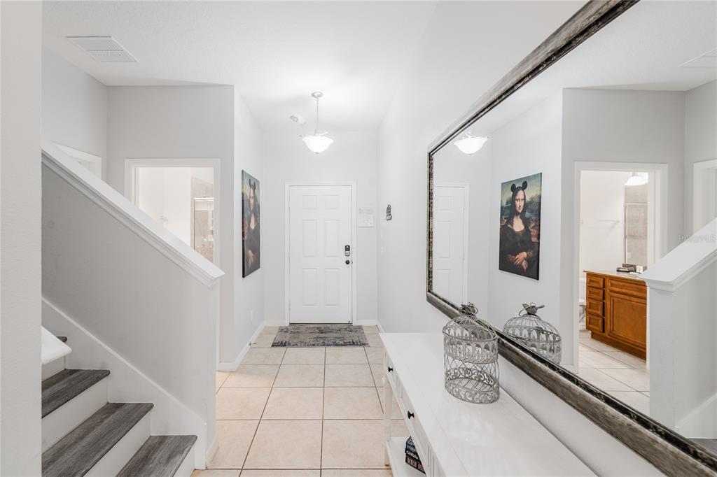 8961 Majesty Palm Road Kissimmee, FL 34747 - Photo 7 of 40 a bathroom with a double vanity sink and a mirror