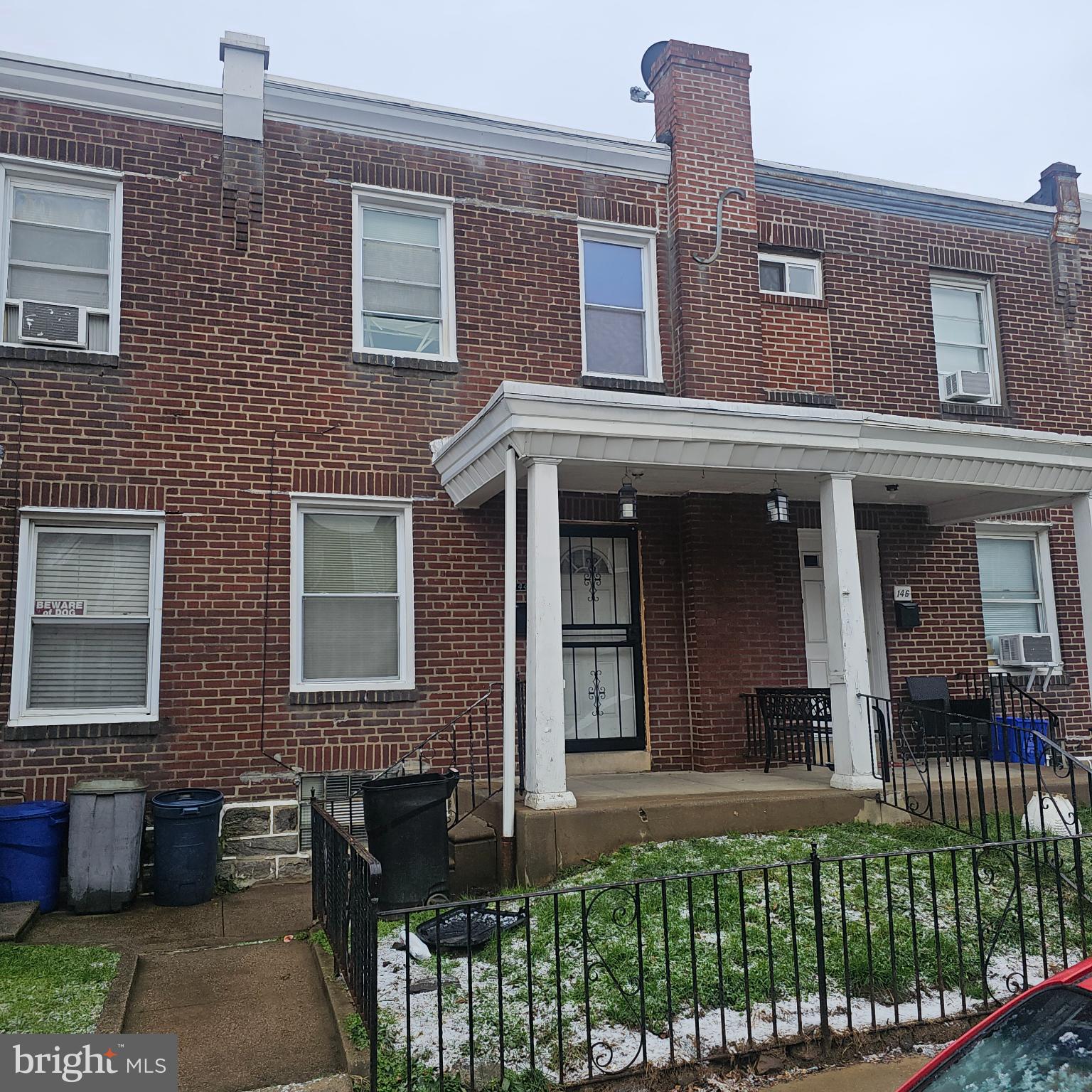 144 Fern Street Philadelphia, PA 19120 - Photo 1 of 12 front view of a brick house with a small yard