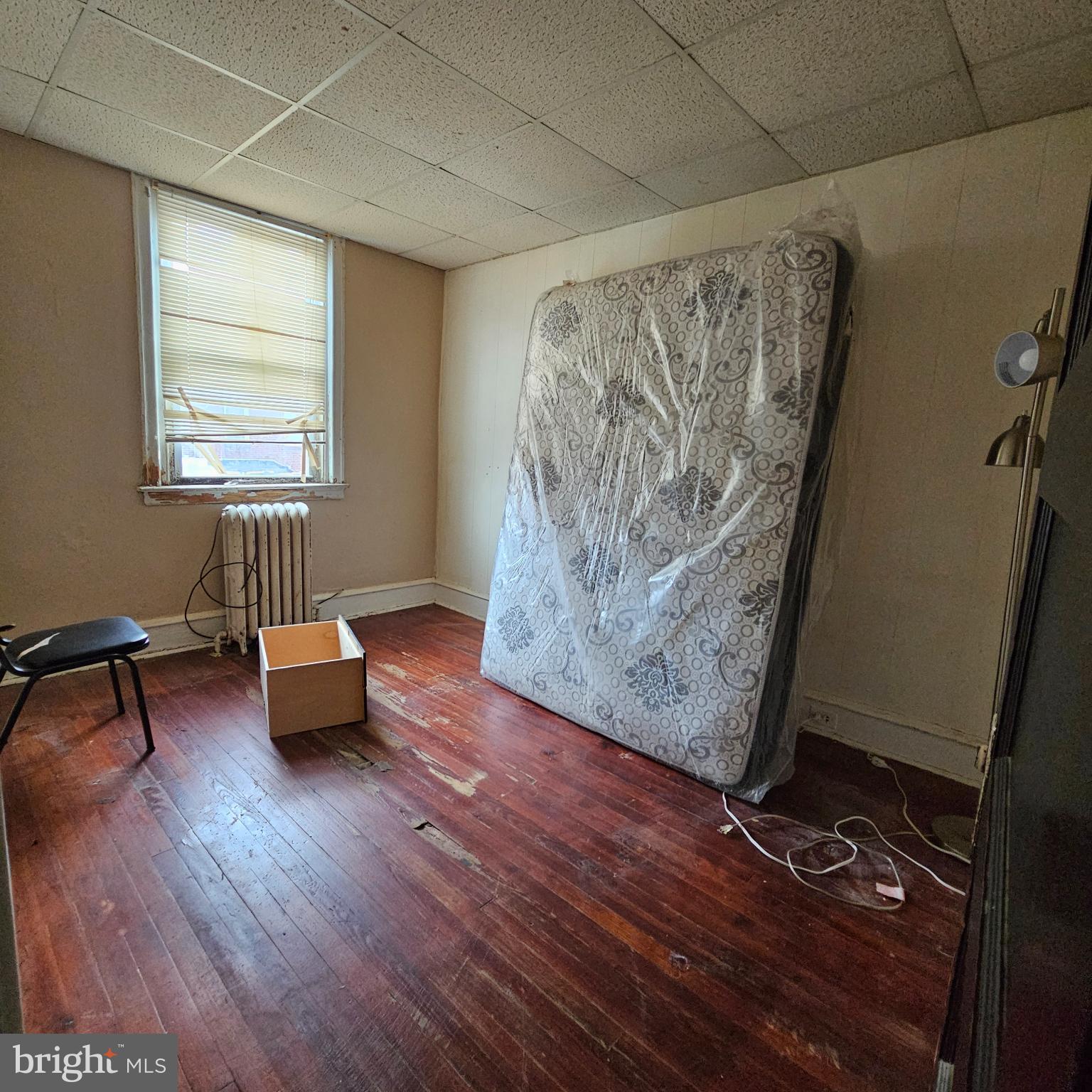 144 Fern Street Philadelphia, PA 19120 - Photo 11 of 12 a living room with furniture and a wooden floor
