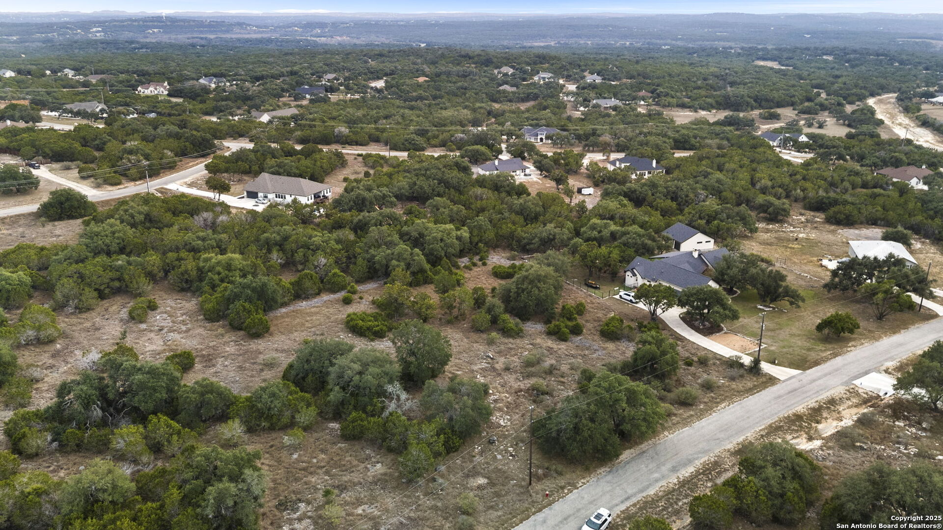 137 Red Tail Cove Spring Branch, TX 78070 - Photo 11 of 13 an aerial view of residential houses with city and green space