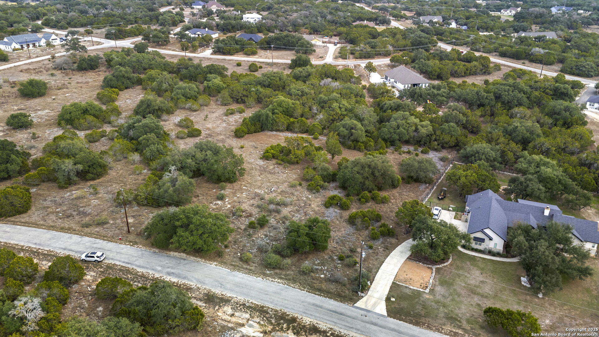 137 Red Tail Cove Spring Branch, TX 78070 - Photo 10 of 13 an aerial view of residential houses with outdoor space