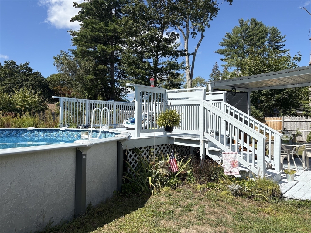 21 Sully Road Raynham, MA 02767 - Photo 7 of 22 a balcony with furniture and wooden floor
