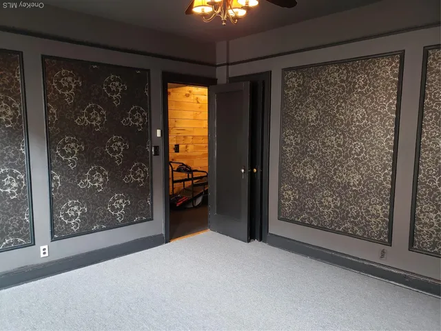 a view of a room with a large window